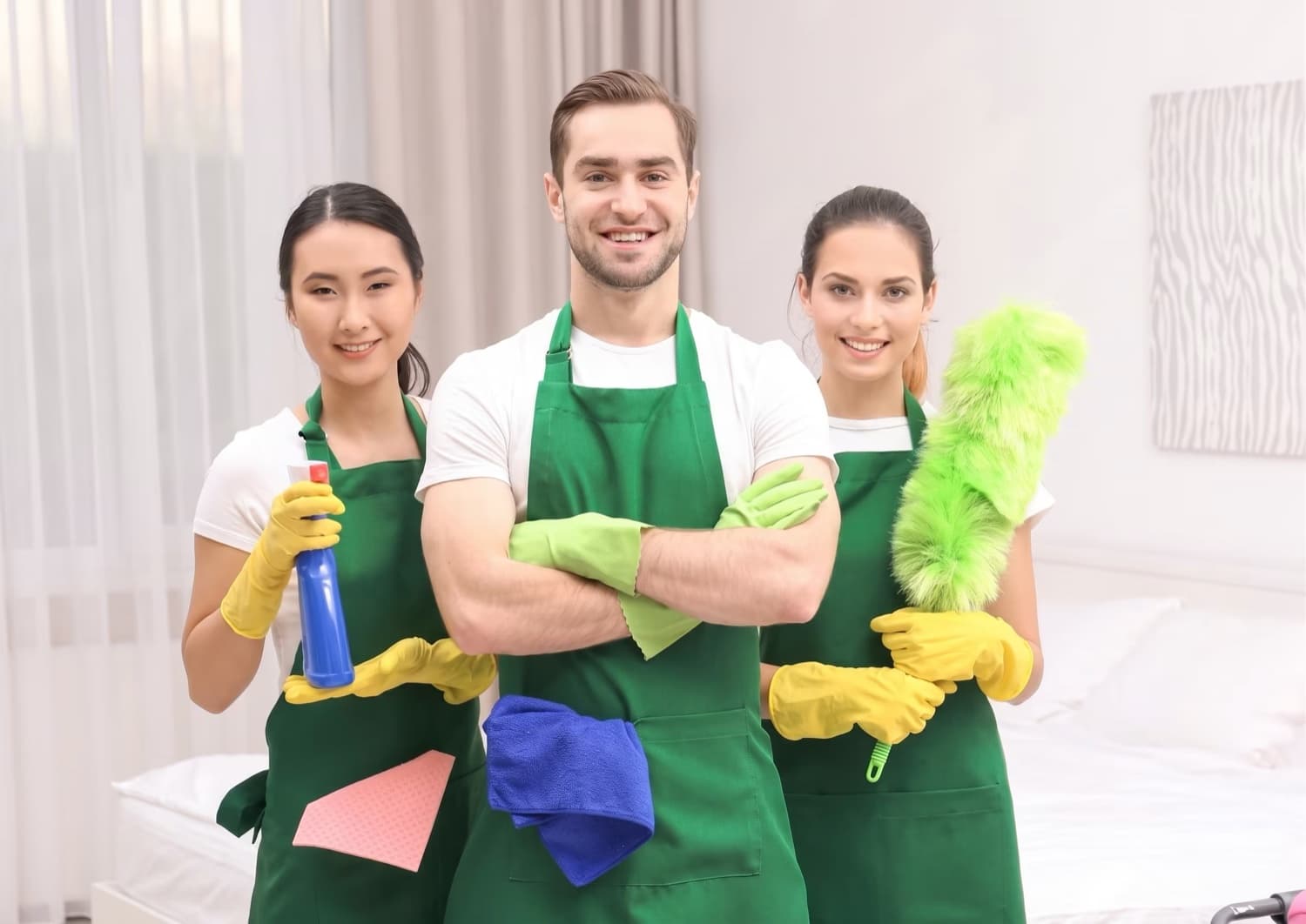 Cleanerway friendly professional cleaners smiling in aprons ready for service in Melbourne